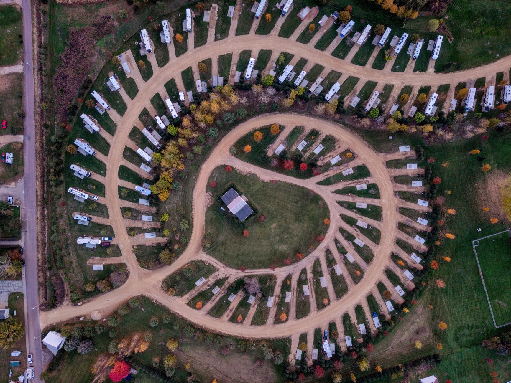 Aerial view of a full campground with RVs on every site